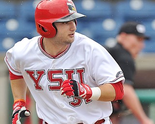 Jeff Lange | The Vindicator  FRI, APRIL 22, 2016 - YSU's Gerrard Rohan watches his hit up the middle as he sprints to first in the third inning of Friday's game against Wright State in Niles.