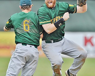 Jeff Lange | The Vindicator  FRI, APRIL 22, 2016 - After defeating Youngstown State University, 7-3, in game one of a double header, Wright State University first baseman Gabe Snyder (right) celebrates with third baseman John Brodner Friday afternoon at Eastwood Field in Niles.