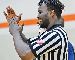 Jeff Lange | The Vindicator  FRI, APRIL 22, 2016 - University of Michigan tailback De'Veon Smith calls a technical foul against Team Police in the second half of Friday night's Guns vs. Hoses charity basketball game held at Howland High School.