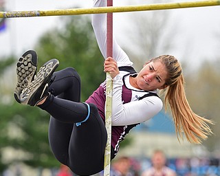 AUSTINTOWN, OHIO - APRIL 23, 2016: Cassie Harsh of Boardman flies through the air during the girls pole vault during the 103rd Annual Mahoning County Track & Field Championships. DAVID DERMER | THE VINDICATOR