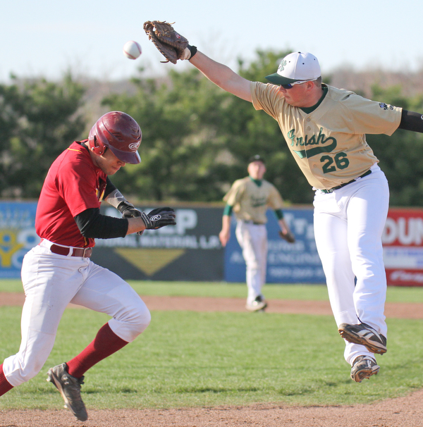 William D Lewis  The Vindicator Mooney's Devin Curd(2) is safe at first as Ursuline's ???? Bokesh(26) baubles the ball during 1rst inning 4-24-16 at Cene.