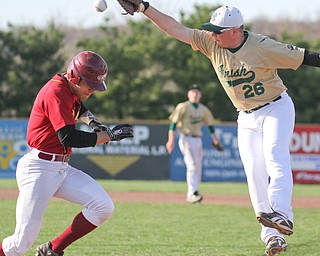William D Lewis  The Vindicator Mooney's Devin Curd(2) is safe at first as Ursuline's ???? Bokesh(26) baubles the ball during 1rst inning 4-24-16 at Cene.