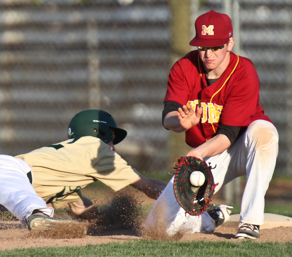 William D Lewis  The Vindicator  Ursuline's (12) beats the throw back to Mooney firstbaseman (11) during 4-24-16 game at Cene.