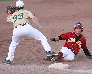 William D Lewis  The Vindicator Mooney's (2) is safe at 3rd while Ursuline's (33) waits for the throw during 6 th inning at Cene 4-24-16.