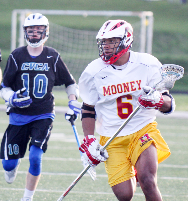 william d Lewis the vindicator  Mooney's Ashraf Musleh(9) moves the ball past CVCA's Ryan Oconnor(10) during 4-26-16 action at Mooney.