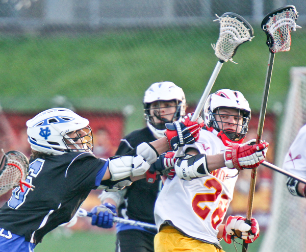 william d Lewis the vindicator Mooney's Tony Zeno(28) and CVCA's Daniel Diblasi(6) mix it up during 4-26-16 action at Mooney.