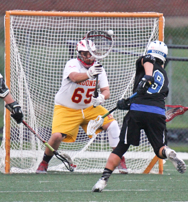 william d Lewis the vindicator  Mooney goal keeper David Sadinski(65) blocks a shot from CVCA'sJack Atwood(9) during 4-26-16 action at Mooney.