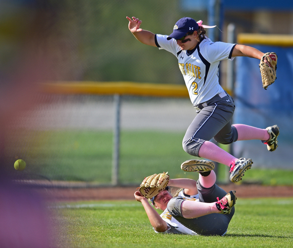 KENT, OHIO - APRIL 27, 2016: Left fielder Hunter Brancifort #2 hurdles over short stop Holly Speers #10 of Kent State after the two were unable to make a play not he ball in the second inning of game two Wednesday night at the Diamond at Dix. Kent State won game two 3-2. DAVID DERMER | THE VINDICATOR.