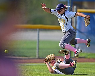 KENT, OHIO - APRIL 27, 2016: Left fielder Hunter Brancifort #2 hurdles over short stop Holly Speers #10 of Kent State after the two were unable to make a play not he ball in the second inning of game two Wednesday night at the Diamond at Dix. Kent State won game two 3-2. DAVID DERMER | THE VINDICATOR.