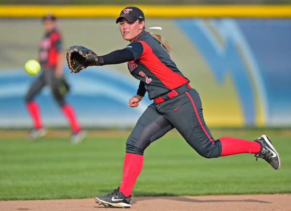 KENT, OHIO - APRIL 27, 2016: Brittney Moffatt #2 of YSU reaches for the ball in an attempt to keep it from going into center field for a Kent State base by Emily Dobbin in the fifth inning of game two Wednesday night at the Diamond at Dix. Kent State won game two 3-2. DAVID DERMER | THE VINDICATOR