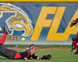 KENT, OHIO - APRIL 27, 2016:  Center fielder Jordan Macey #10 of YSU slides on the turf after unsuccessfully diving to catch the ball while Cali Mikovich #4 goes after the ball in the fifth inning of game two Wednesday night at the Diamond at Dix. Kent State won game two 3-2. DAVID DERMER | THE VINDICATOR