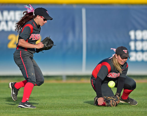 KENT, OHIO - APRIL 27, 2016: Cali Mikovich #4 of and Brittney Moffatt #2 of YSU watch as the softball falls to the turf after the ball popped out of the glove of Mikovich in shallow right field allowing a Kent State runner to reach base in the sixth inning of game two Wednesday night at the Diamond at Dix. Kent State won game two 3-2. DAVID DERMER | THE VINDICATOR