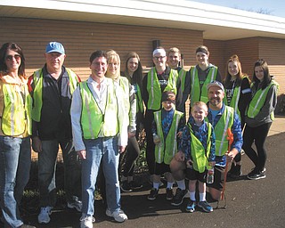 SPECIAL TO THE VINDICATOR
Members of the Rotary Club of Austintown and Fitch Interact Club recently spent a Saturday morning cleaning Kirk Road from Route 46 to Whispering Pines Drive. This joint project has taken place twice a year since 2001. In front from left are Reagan Kalaher, Collin Kalaher and their father, Ed Kalaher who is kneeling. Standing from left are Chris Gaca, Mal Culp, Mitch Dalvin, Tracie Kaglic, Gina DiFrancesco, Erica DiFrancesco, Tim Kubacki, Rachael DiFrancesco, Allison Kaglic and Dannah Lewis. Advisers are Tina Kubacki and Gary Reel.