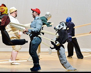 Youngstown's Kyle Shehadi (center) and other members the Sigma Tau Gamma fraternity perform a dance routine with life-sized puppets during a greatest hits of the 90s medley during Saturday night's The 90's Greeksing held at Stambaugh Auditorium in Youngstown on April 9, 2016.