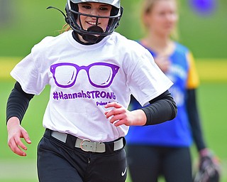 STRUTHERS, OHIO - APRIL 30, 2016: Emily Grandy #7 of Struthers trots around the bases after a grand slam in the second inning of Saturday mornings game against Valley Christian. She is wearing a HannahStrong shirt showing her support for Hannah Tringhese. DAVID DERMER | THE VINDICATOR