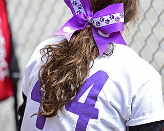 STRUTHERS, OHIO - APRIL 30, 2016: Brianna Leonard #44 of Struthers sits in the dugout while wearing a HannahStrong shirt and a bow in her hair showing her support for Hannah Tringhese. DAVID DERMER | THE VINDICATOR