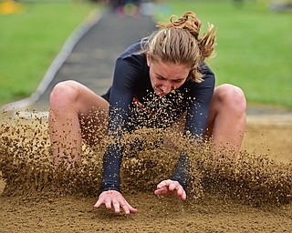 POLAND, OHIO - APRIL 30, 2016: Alex Othman of Howland sticks the landing in the sand during the girls long jump Saturday afternoon during the Poland Invitational at Poland High School. DAVID DERMER | THE VINDICATOR