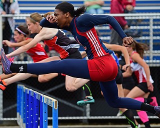 POLAND, OHIO - APRIL 30, 2016: Khala Cameron of Fitch clears a hurdle in the girls 100 meter hurdles finals Saturday afternoon during the Poland Invitational at Poland High School. DAVID DERMER | THE VINDICATOR