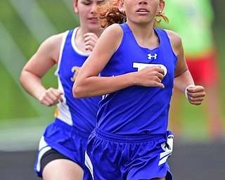 POLAND, OHIO - APRIL 30, 2016: Josie Mayle of Poland jogs in front of Elliz Slabaugh of Lake Center during the girl 1600 meter run Saturday afternoon during the Poland Invitational at Poland High School. DAVID DERMER | THE VINDICATOR