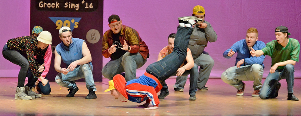 Jeff Lange | The Vindicator  SAT, APRIL 9, 2016 - Youngstown's Jay King of Alpha Phi Delta (center) does the worm as his fraternity brothers look on in amazement during their performance of "This Is How We Do It" by Montell Jordan during YSU's Greeksing at Stambaugh Auditorium Saturday night.