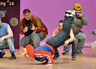 Jeff Lange | The Vindicator  SAT, APRIL 9, 2016 - Youngstown's Jay King of Alpha Phi Delta (center) does the worm as his fraternity brothers look on in amazement during their performance of "This Is How We Do It" by Montell Jordan during YSU's Greeksing at Stambaugh Auditorium Saturday night.