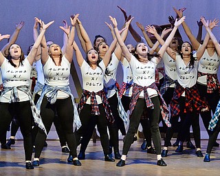 Jeff Lange | The Vindicator  SAT, APRIL 9, 2016 - Members of YSU's Alpha Xi Delta Sorority raise their arms as they perform"Queen of the Night" by Whitney Houston during their performance in the YSU 90's Greeksing at Stambaugh Auditorium Saturday night.