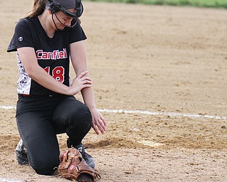 William D. Lewis The Vindicator  Canfield pitcher reacts after being struck by a line drive during 5/3/16 game with Jefferson.