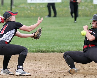 William D Lewis the Vindicator  Canfield's Jill Baker(11) baubles the ball as Jeffersons Sam Hamski(10) heads to 2nd during 6th inning of a 5/3/16 game at Canfield.