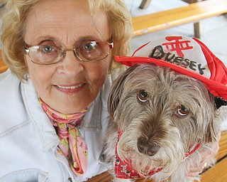 William D. Lewis The vindicator  Duessy, a dog owned by Mary Zalac of coitsville, wheels his way along ina toy firetruck during dog event in Boardman Park 5-4-16.