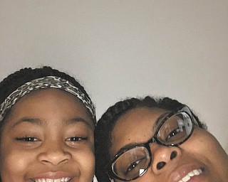 An unedited letter from Daelyn McGuire, left, of Youngstown, had some sweet thoughts about her mom Eslyn Woodberry: "My mother is special because she feeds me and she buys me the stuff that I want and she gives me birthday prizes and she buys me shoes and gold earrings and she is there when I have tough times and she sometimes works at my school and that's why she's special to me."