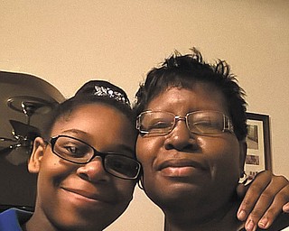 Taylor Christine Donlow, left, of Youngstown says her mom Alma Faye Donlow means everything to her. Alma helps her daughter manage her Type 1 diabetes and keeps her dressed stylishly. Taylor is amazed that her mom works, cooks and cleans each day and still has time to do good.