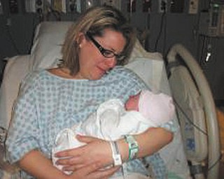 "My name is Emma Aurelia Bassetti, but my mom didn't name me right away. After I was born on April 9 at 4:26 a.m., my mom waited until the day I left the hospital before I had an identity. But I'm not holding that against her because she was careful and ate healthy foods while I was in her tummy for nine months. She's telling her friends that I'm a good baby now, but wait until I'm a teenager and give her a hard time. I'd like to prove her wrong when that time comes because she's a good mom and I love her and don't want to disappoint her. Whaaaaaaaaa!".