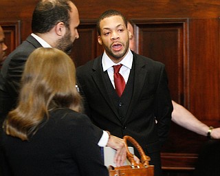  ROBERT K YOSAY | THE VINDICATOR.. Hakeem Henderson - red tie beard  talks to his lawyer before being led away.A jury today in Mahoning County Common Pleas Court has found Michael Austin, 22, guilty of three counts of murder, one count of murder and engaging in a pattern of corrupt activity..Austin was found not guilty of a separate charge of attempted murder..Hakeem Henderson, 24, was found guilty of two counts of aggravated murder, not guilty of two counts of aggravated murder, and engaging Ina pattern of corrupt activity...--30-