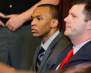   ROBERT K YOSAY | THE VINDICATOR..Michael Austin is clean shaven listens to the verdicts..A jury today in Mahoning County Common Pleas Court has found Michael Austin, 22, guilty of three counts of murder, one count of murder and engaging in a pattern of corrupt activity..Austin was found not guilty of a separate charge of attempted murder..Hakeem Henderson, 24, was found guilty of two counts of aggravated murder, not guilty of two counts of aggravated murder, and engaging Ina pattern of corrupt activity...--30-