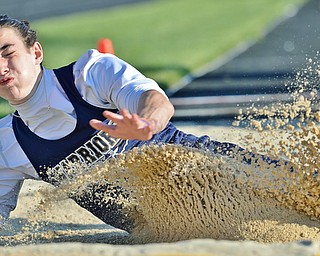 Jeff Lange | The Vindicator  THU, MAY 5, 2016 - Brookfield's Kasey Tingler crashes in the sand as he jumps 22 feet, 10.25 inches in the boys' long jump event during a track meet at Lakeview High School.
