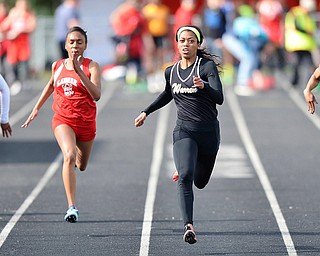 Jeff Lange | The Vindicator  THU, MAY 5, 2016 - Warren Harding's Justice Richardson (right center) leads the pack as she sprints to the finish line in the girls 100 meter dash during Thursday's track meet at Lakeview High School.