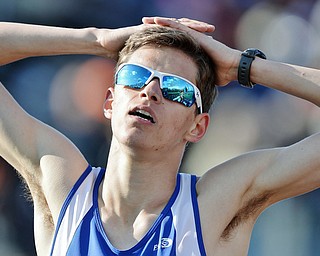 Jeff Lange | The Vindicator  THU, MAY 5, 2016 - Hubbard's  John Marenkovic catches his breath after competing in the boys 1600 meter run during Thursday's track meet at Lakeview High School.