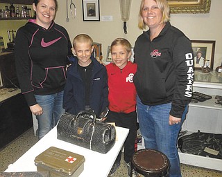 SPECIAL TO THE VINDICATOR | Salem Historical Society Museum, 208 S. Broadway Ave., is offering free admission to mothers Sunday when accompanied by family members. Hours are 1 to 4 p.m. The Gift Shop, 239 S. Lundy Ave., will be open for souvenirs and the Garden Gift Shop also will be open. New members will receive a copy of the 2006 Salem Bicentennial edition, “The Salem Story Continues,” an $18 value. From left are Katie Eckstein, Scott Colian, and Troy and Linda Gibson, who recently visited the museum and recommend others visit the museum to see Salem’s past. For information call the museum at 330-337-8514.