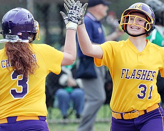 William d Lewis the vindicator Champion's Molly Williams(31) gets congrats from McKenzie Zigmont(3) after scoring winning run in 1-0 win over West Branch 5-6-16 in Liberty .