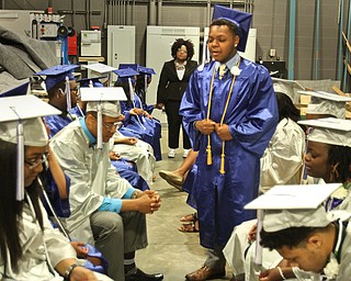 William d Lewis the vindicator YEC graduate Jordan Rawl leads fellow grads in prayer before comencement ceremony 5-6-16 .