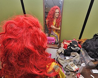 Jeff Lange | The Vindicator FRI, MAY 6, 2016 - Lola Vanhorn of Poland does her hair prior to the start of Friday night's Pride Pageant held at YSU.