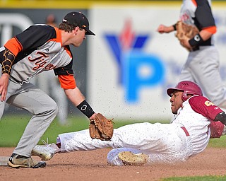 STRUTHERS, OHIO - MAY 10: 2016: Aaron Woodberry #17 of Mooney steals second base beating the tag from Andy Sodergren #10 of Springfield in the fourth inning of Tuesday afternoons game at Cene Park. Mooney won 6-3. DAVID DERMER | THE VINDICATOR