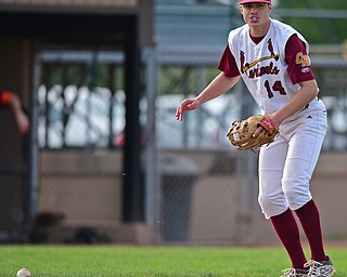 STRUTHERS, OHIO - MAY 10: 2016: Pitcher Jack Lynch #14 of Mooney looks to first base after misplaying the ball and allowing Steve Ranelli #2 of Springfield to reach base in the fifth inning of Tuesday afternoons game at Cene Park. Mooney won 6-3. DAVID DERMER | THE VINDICATOR