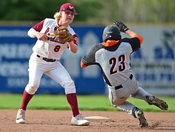 STRUTHERS, OHIO - MAY 10: 2016: Shortstop Bryce Richey #8 of Mooney tags out Anthony Ugolini #23 of Springfield as he attempts to steal second base in the fifth inning of Tuesday afternoons game at Cene Park. Mooney won 6-3. DAVID DERMER | THE VINDICATOR