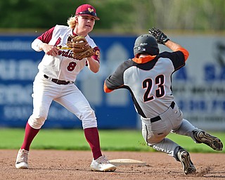 STRUTHERS, OHIO - MAY 10: 2016: Shortstop Bryce Richey #8 of Mooney tags out Anthony Ugolini #23 of Springfield as he attempts to steal second base in the fifth inning of Tuesday afternoons game at Cene Park. Mooney won 6-3. DAVID DERMER | THE VINDICATOR