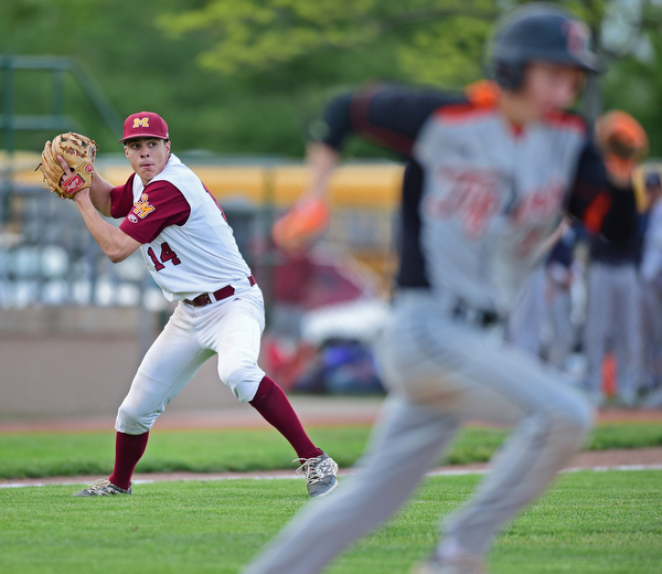 STRUTHERS, OHIO - MAY 10: 2016: Pitcher Jack Lynch #14 of Mooney looks to first base to attempt to throw out Brandon Walters #3 of Springfield after fielding a bunt in the seventh inning of Tuesday afternoons game at Cene Park. Mooney won 6-3. DAVID DERMER | THE VINDICATOR