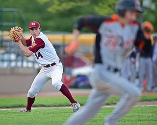 STRUTHERS, OHIO - MAY 10: 2016: Pitcher Jack Lynch #14 of Mooney looks to first base to attempt to throw out Brandon Walters #3 of Springfield after fielding a bunt in the seventh inning of Tuesday afternoons game at Cene Park. Mooney won 6-3. DAVID DERMER | THE VINDICATOR