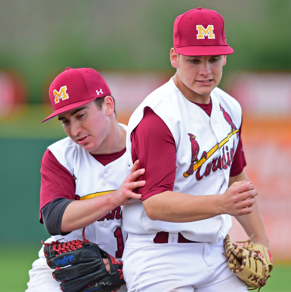 STRUTHERS, OHIO - MAY 10: 2016: First basemen Dom Pecchia #10 is ran into by second basemen Chris Lewis #11 after securing the final out of the seventh inning of Tuesday afternoons game at Cene Park. Mooney won 6-3. DAVID DERMER | THE VINDICATOR