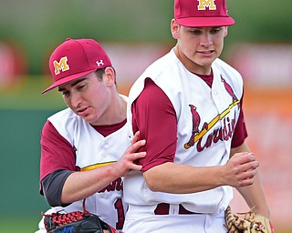 STRUTHERS, OHIO - MAY 10: 2016: First basemen Dom Pecchia #10 is ran into by second basemen Chris Lewis #11 after securing the final out of the seventh inning of Tuesday afternoons game at Cene Park. Mooney won 6-3. DAVID DERMER | THE VINDICATOR