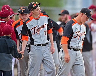 STRUTHERS, OHIO - MAY 10: 2016: Russ Seymour #25 and AJ Joseph #12 of Springfield show their frustration after shaking hands after losing to Mooney after Tuesday afternoons game at Cene Park. Mooney won 6-3. DAVID DERMER | THE VINDICATOR